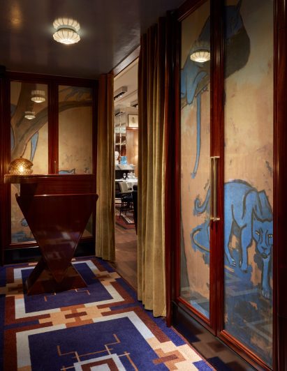 Blue panthers on the walls that lead to the dining room