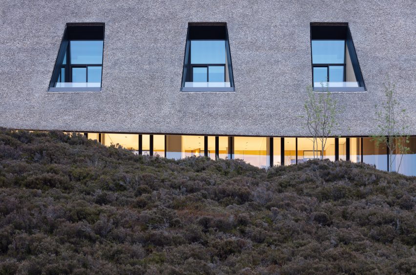 The thatch meets the dunes to blend into the landscape