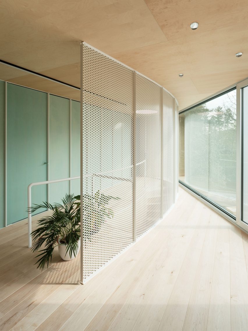 Wood-lined interior at the BEEV home by ISM Architecten