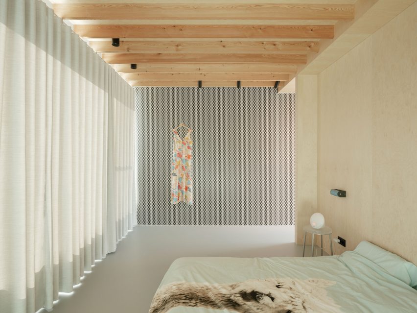 Wood-lined bedroom at the BEEV home by ISM Architecten