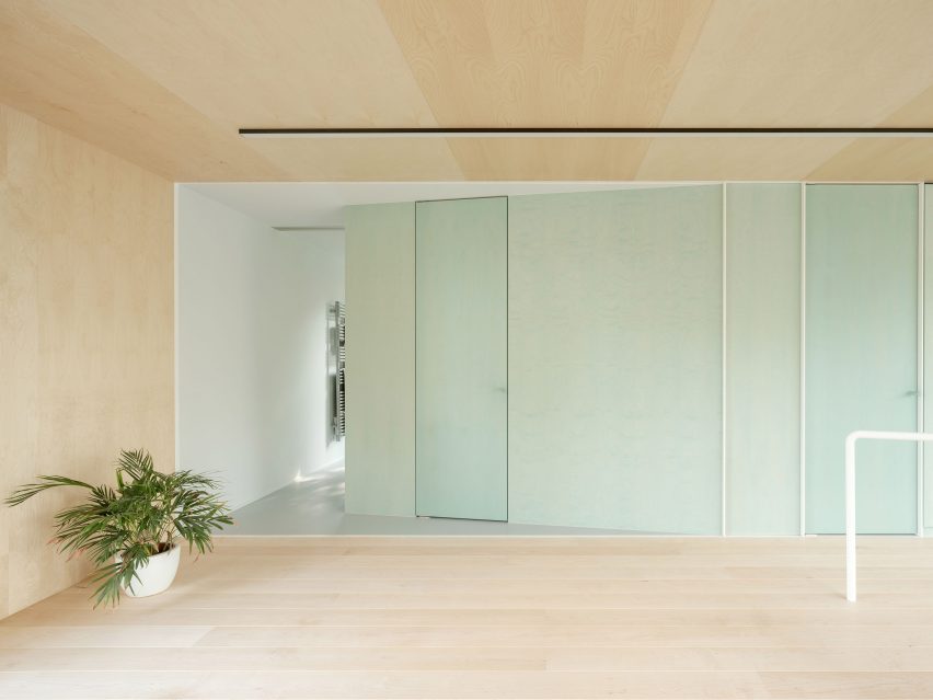 Wood-lined interior at the BEEV home by ISM Architecten