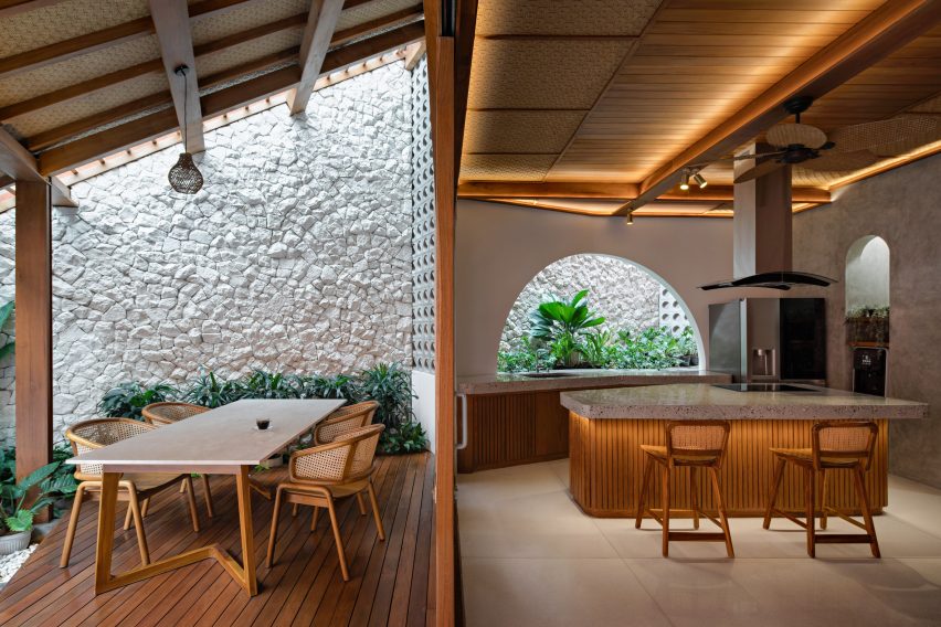 Kitchen with a covered outdoor dining terrace