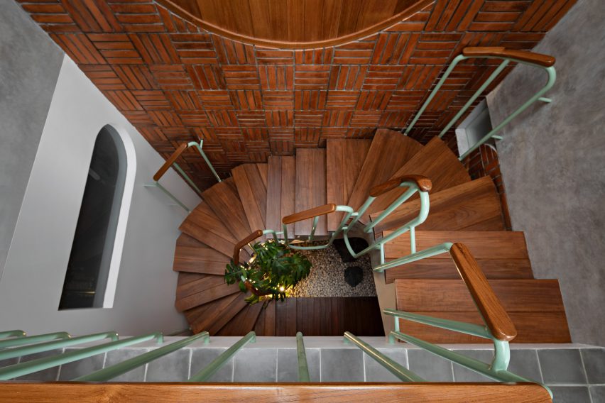 Timber staircase at Distracted House by Ismail Solehudin Architecture