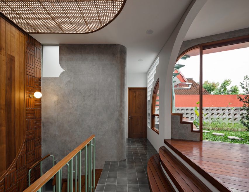 Staircase landing at Distracted House by Ismail Solehudin Architecture