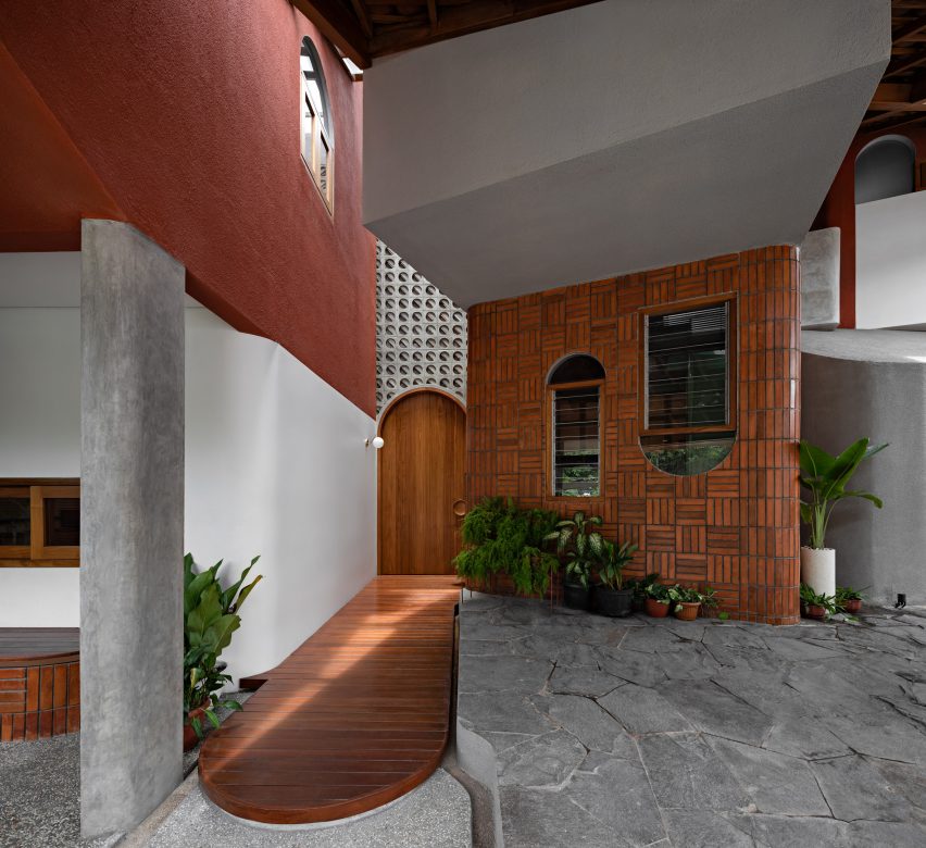 Concrete and wood interior of Distracted House in Indonesia by Ismail Solehudin Architecture