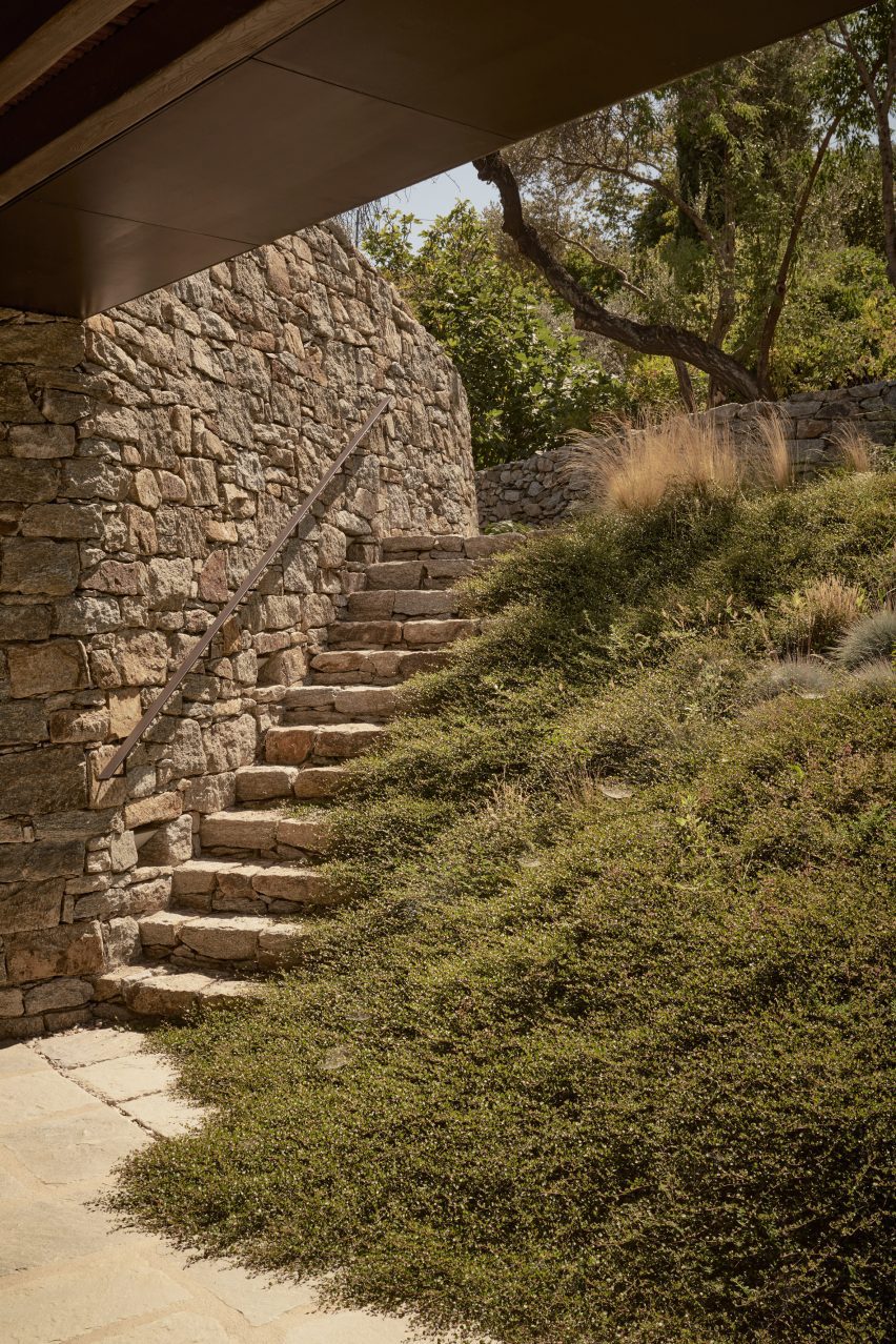 Stone steps leading to the Liknon building by K-studio