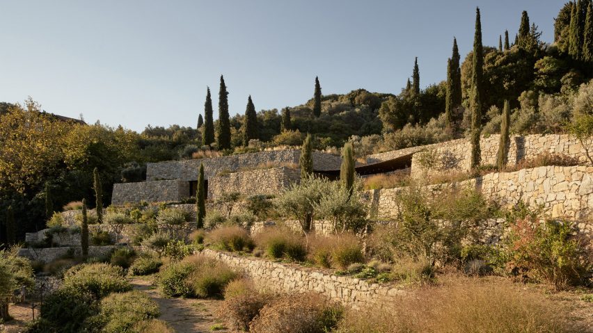 Liknon stone building by K-studio on a hillside