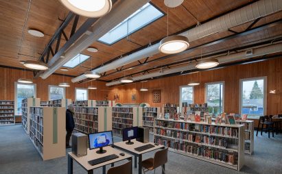 Bookshelves in a library with wood walls