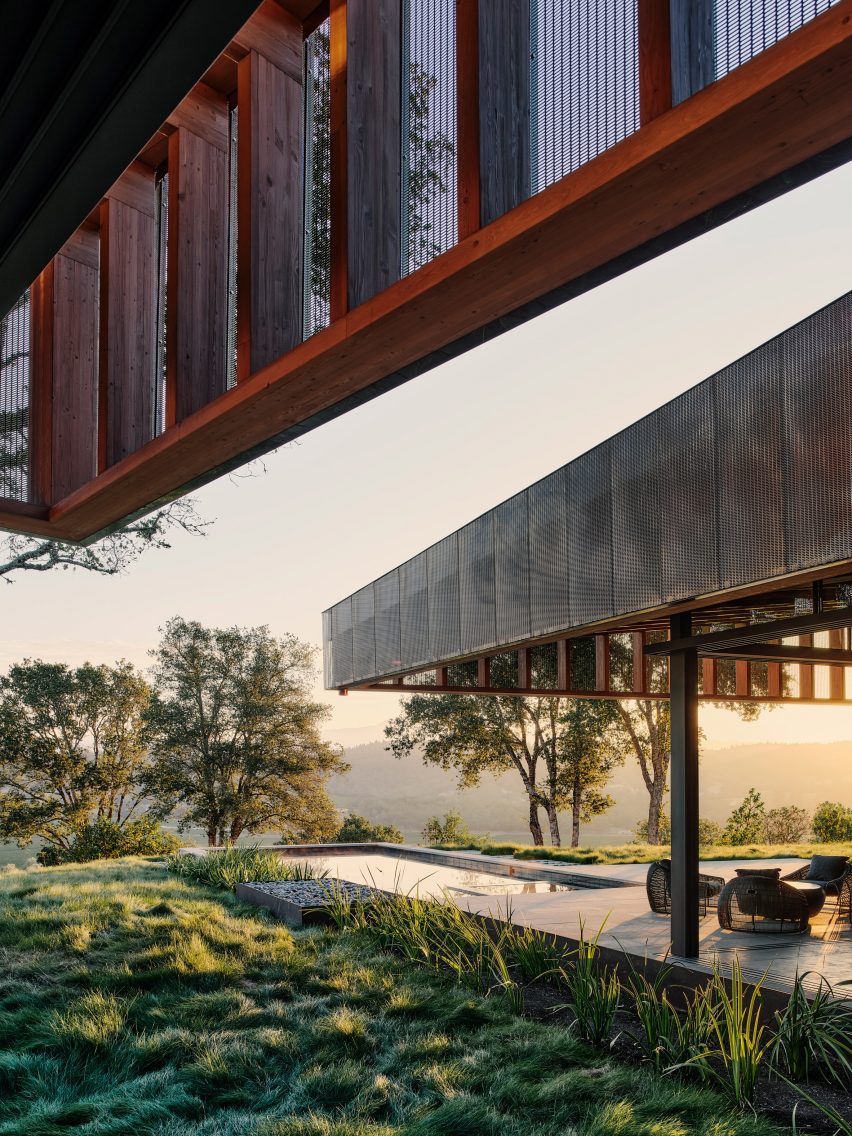 Two copper soffits extending over a house and ridge