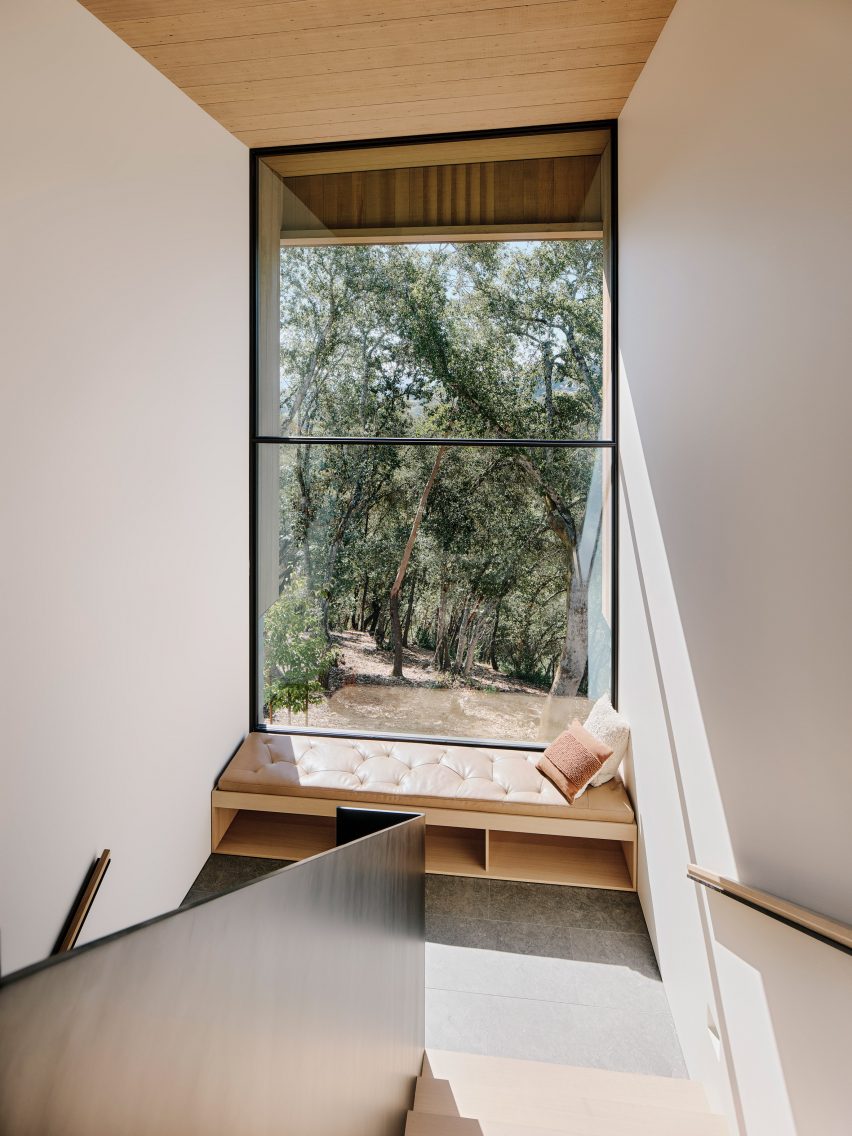 A window seat in front of a large window