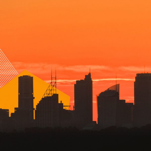Artwork image showing a shadowed city scape overlaid on top of an orange sky.
