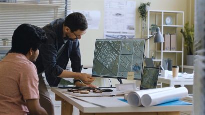 A tutor teaching a student to use design software.