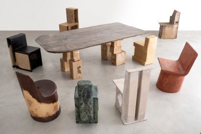 Cardboard table surrounded by cardboard chairs