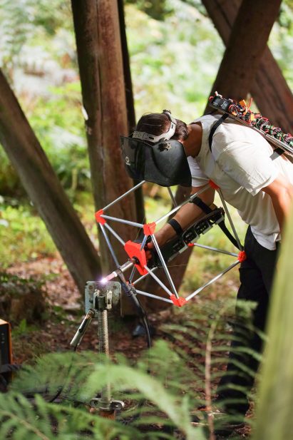 Jasper Mallinson using his Mecha-morphis device to weld some metal 
