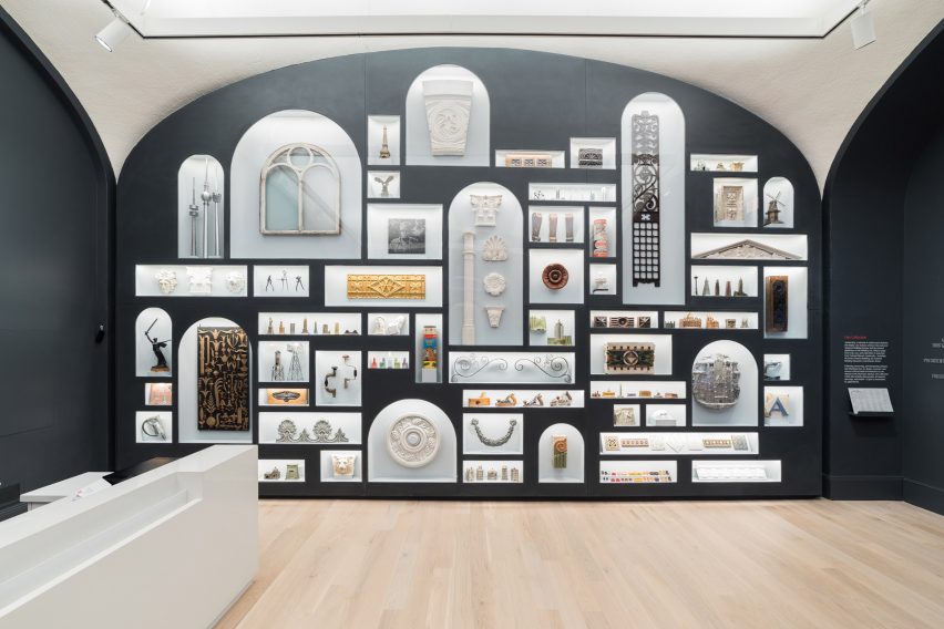 A wall with arched bookcase