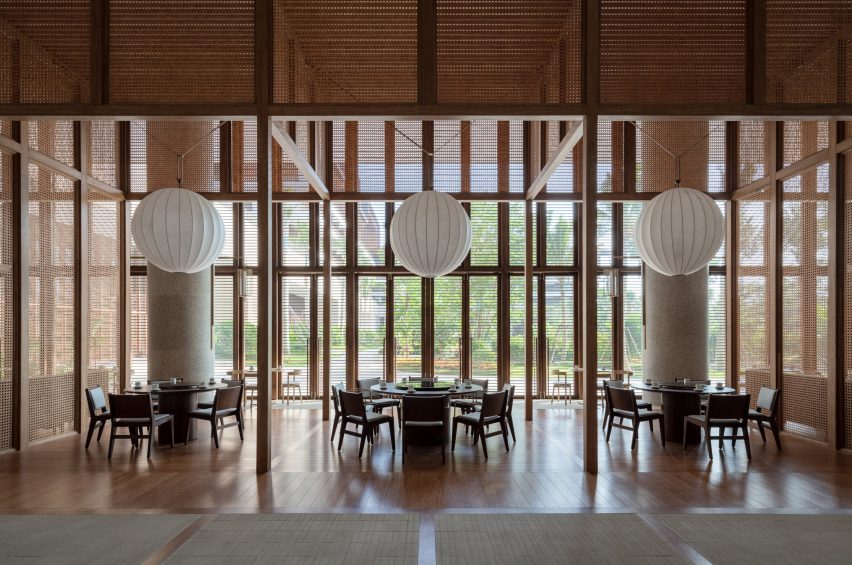 Wooden hotel lounge interior with spherical lantern lights