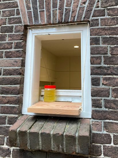 Jar of pee on a ledge at New Store pop-up