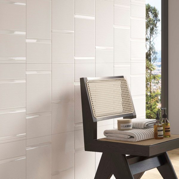 Beige tiles on bathroom wall