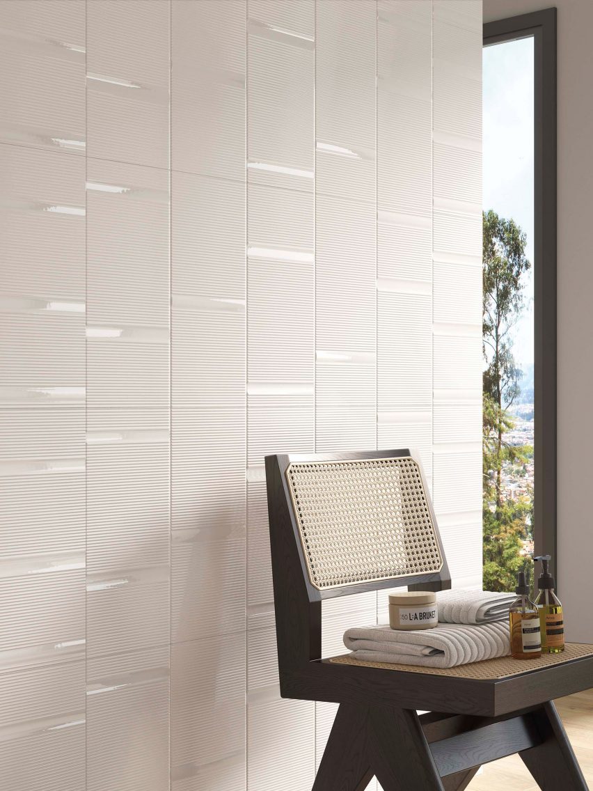 Beige tiles on bathroom wall