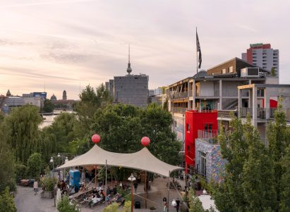 Red timber Haus 2+ office building by Office ParkScheerbarth