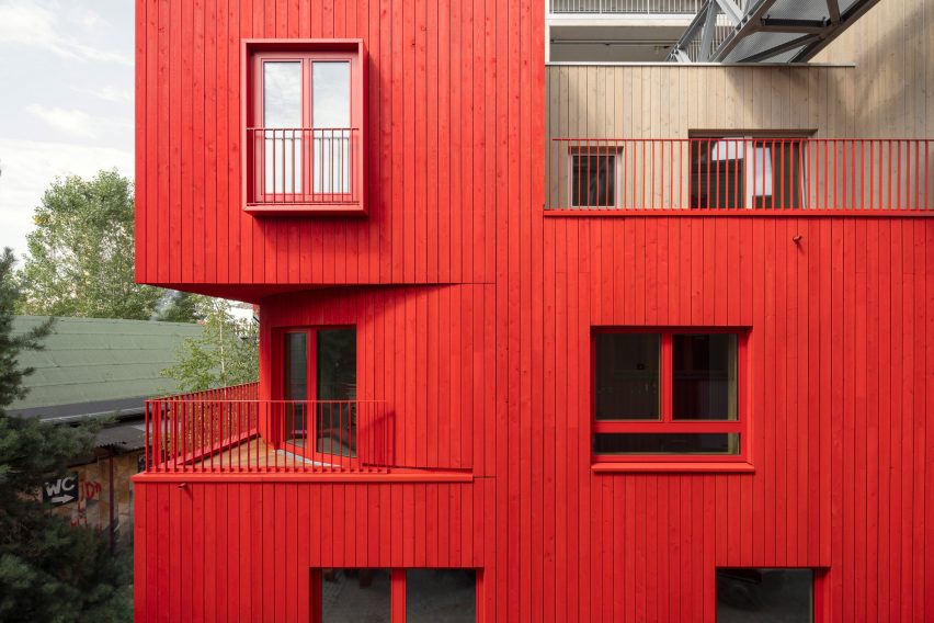 Red wood cladding on the Haus 2+ office building by Office Park Scheerbarth