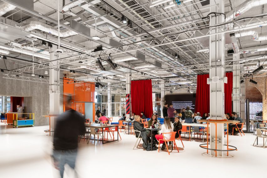 Industrial warehouse space with orange seating