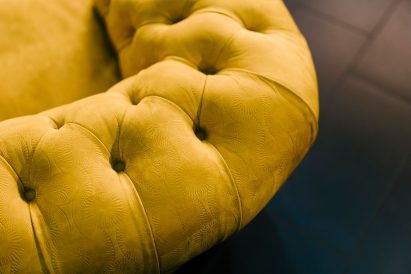 Yellow Chester armchair with embossed leather finish by Ozwald Boateng and Poltrona Frau