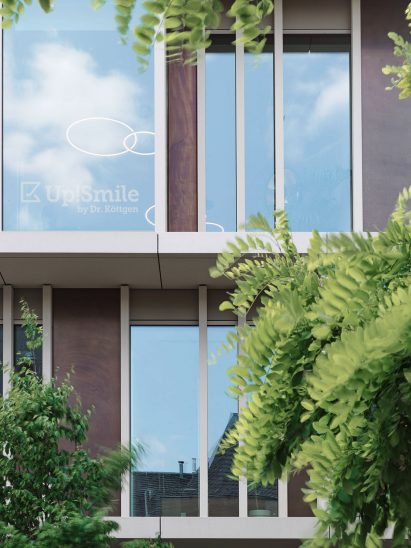 A facade with concrete elements and copper panels