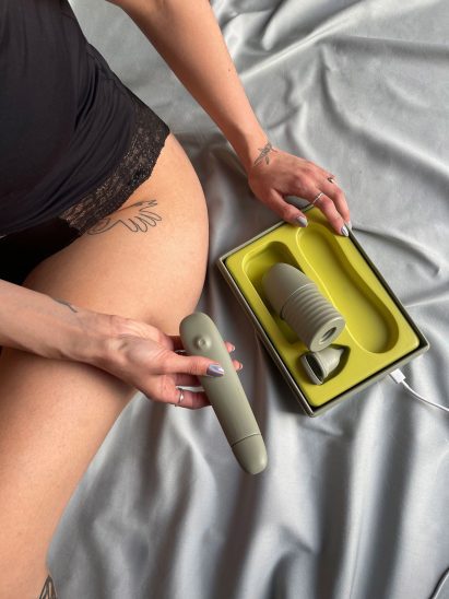 Close-up of person holding Vruit sex toy set for at-home artificial insemination by Juliane Kühr