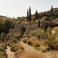 Liknon stone building on a hillside by K-studio