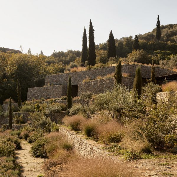 Liknon stone building on a hillside by K-studio
