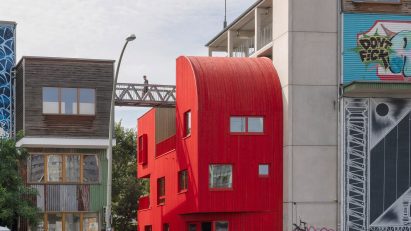 Red timber Haus 2+ office building by Office ParkScheerbarth