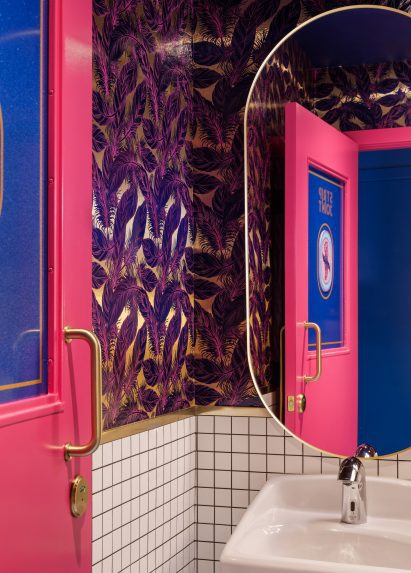 Bathroom interior with feathery wallpaper