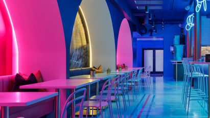 Neon lighting illuminates Strip Joint Chicken by Amanda Hamilton