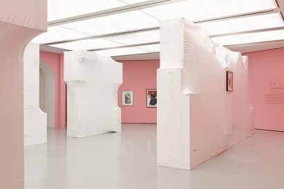 Shrink-wrapped blocks against a pink backdrop