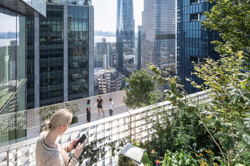 People looking out over NYC on a terrace