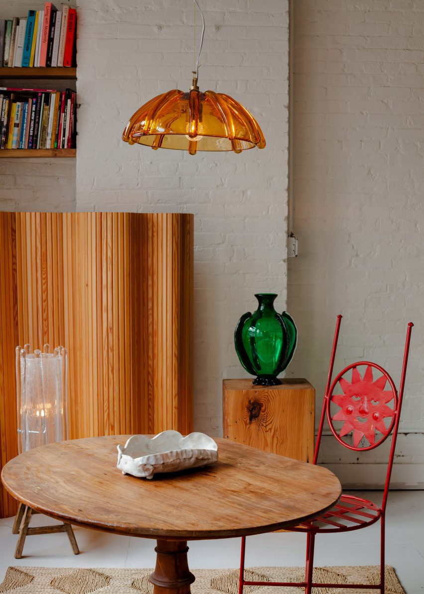 Wooden furniture with colourful glasswork installed on top
