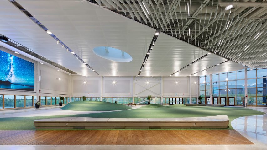 A sloped ceiling over a faux grass