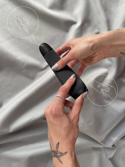 Person pressing a bottom at the base of a vibrator