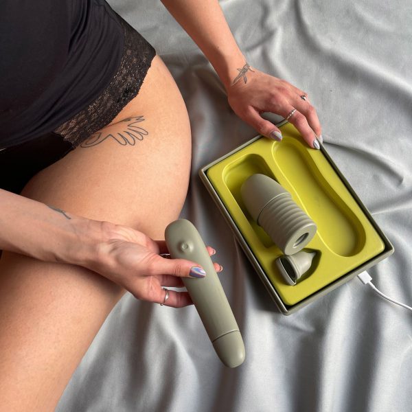 Close-up of person holding Vruit set of sex toys for at-home artificial insemination by Juliane Kühr