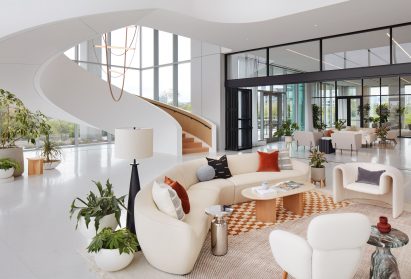 White spiral staircase behind a seating area