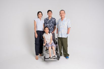 Photo of four models, a mix of disabled and able-bodied people, wearing Will & Well's Adaptable clothing collection