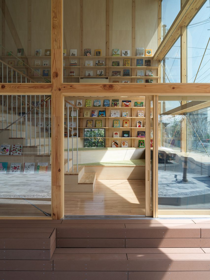 View into entrance space showing wooden steps of children's library