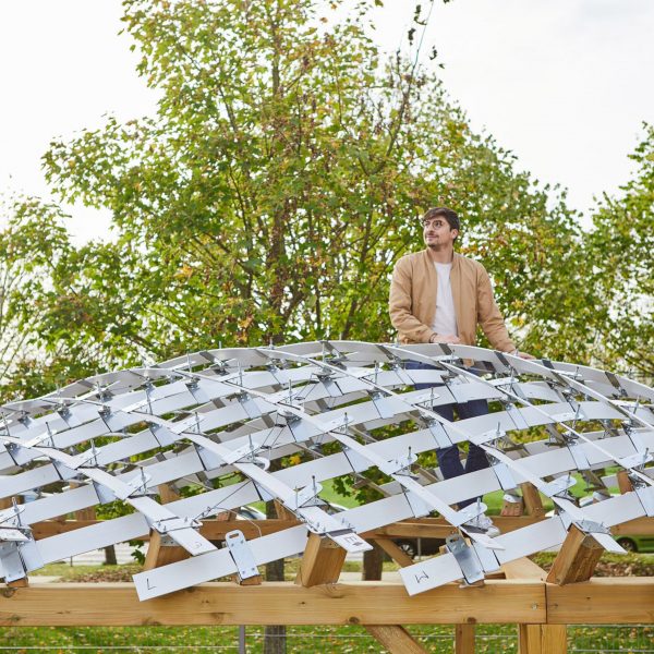 Student climbing architectural model