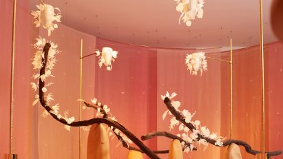 Floral art installation with long branches called The Pollination Dance