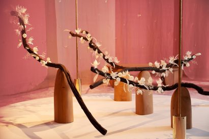 Floral art installation with long branches called The Pollination Dance