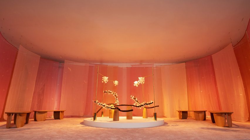 Floral art installation with long branches called The Pollination Dance