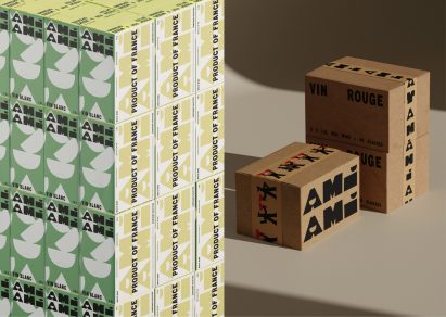 Stacked os Ami Ami white wine next to larger packaging boxes