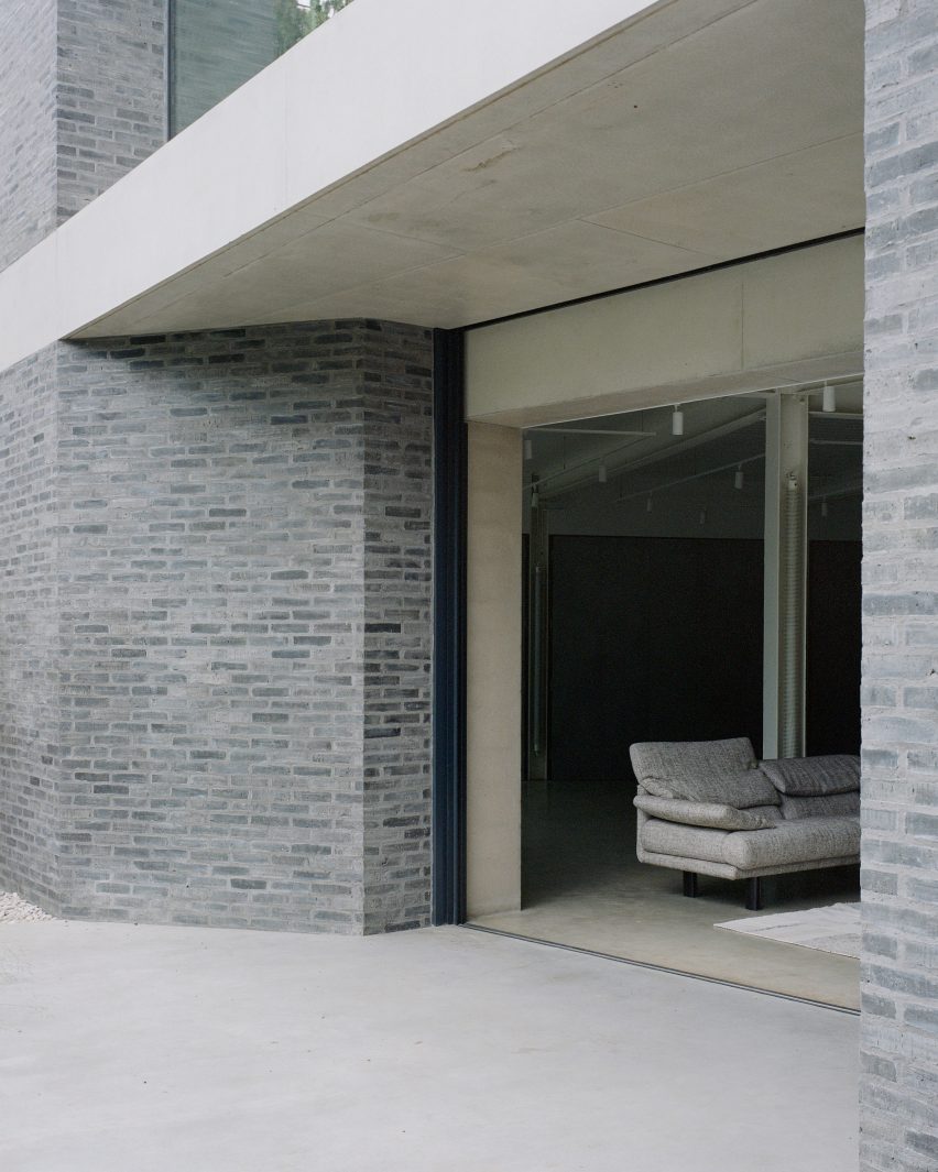Brick exterior wall and full-height window at Camden Workshop by McLaren Excell
