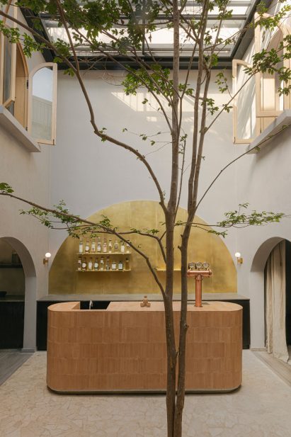 Double-height courtyard with bar at centre